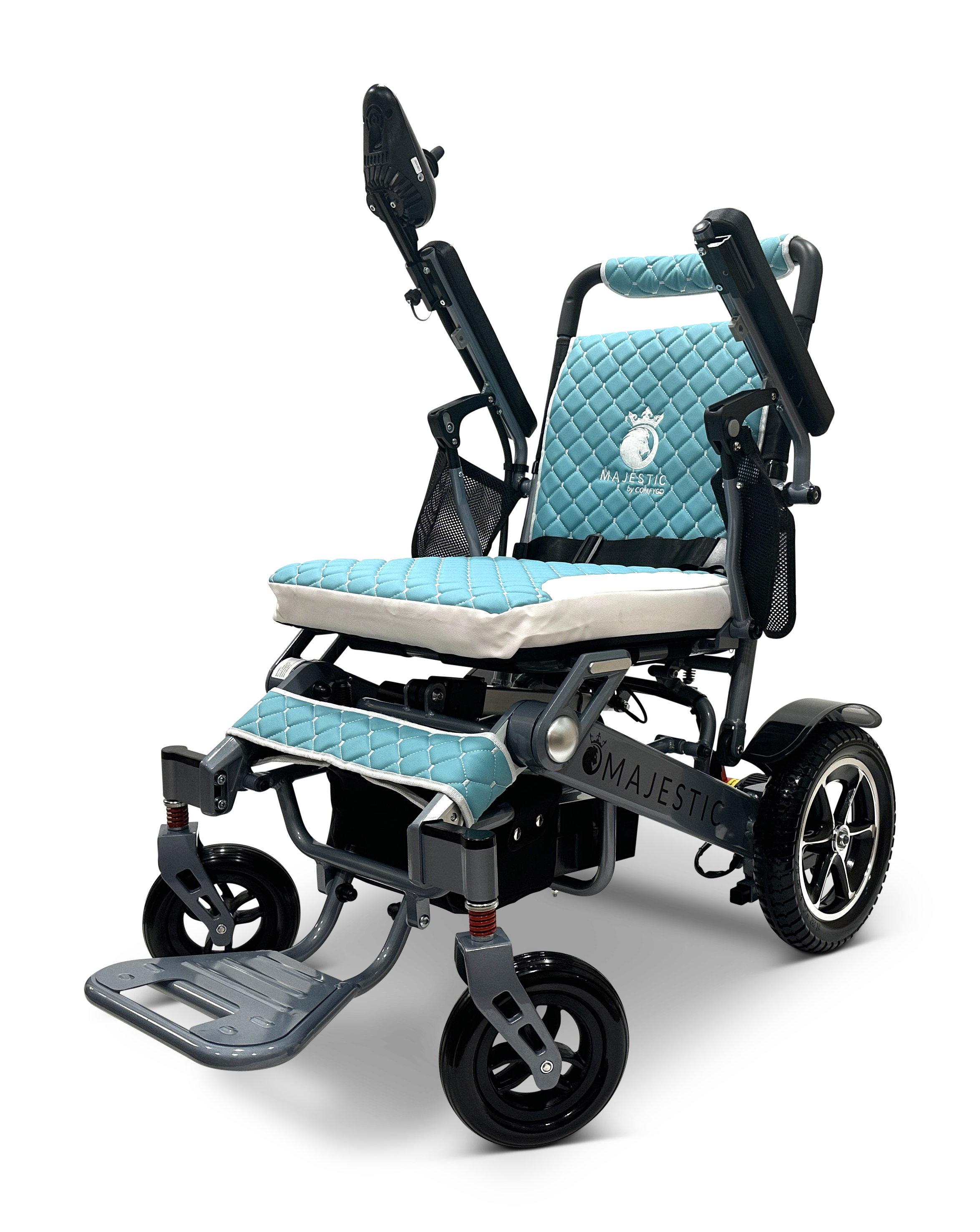 The MAJESTIC IQ-7000 is a lightweight, auto-folding electric wheelchair featuring a blue quilted seat and backrest, large rear wheels, smaller front wheels, armrests, and a 360-degree joystick. The brand name Majestic is visible on the frame.